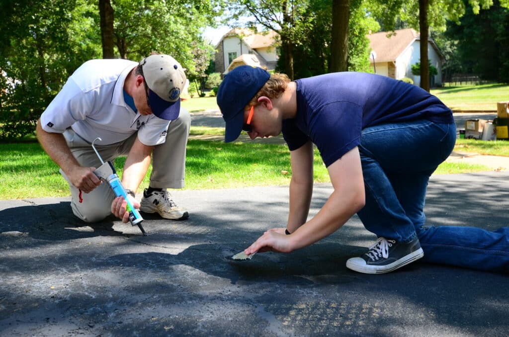 How To Resurface Asphalt Driveway Cracks And Holes Kyle S Garage