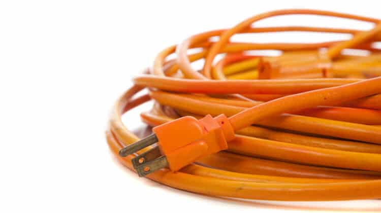 An orange extension cord on a white background