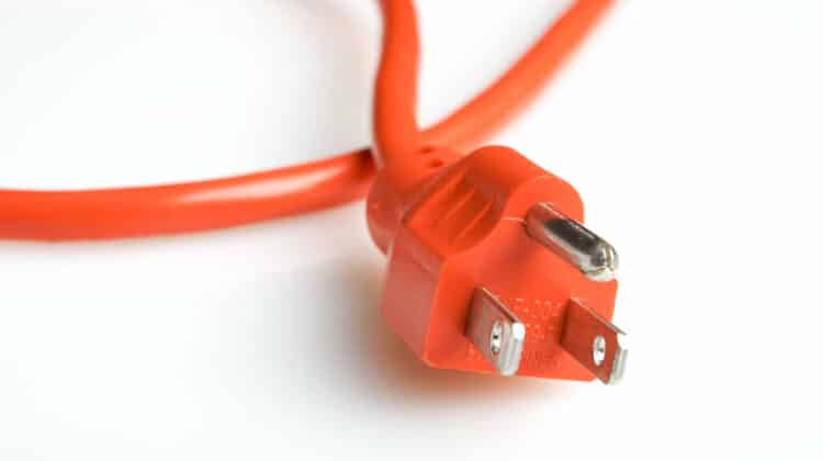 Close up of an orange power plug