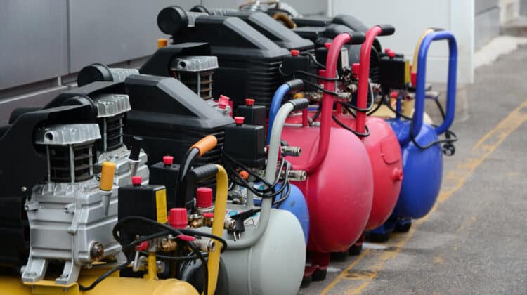 Many new air compressors pressure pumps close up photo