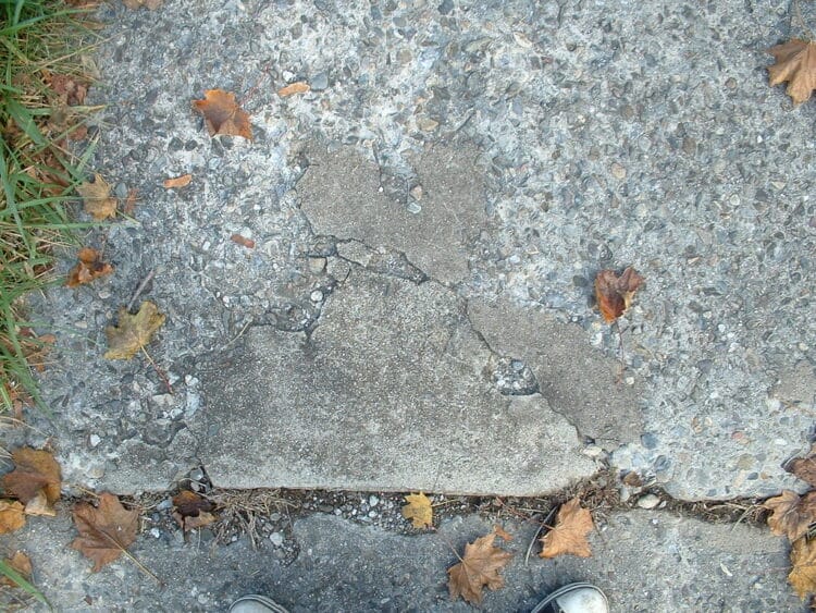 grinding concrete sidewalk