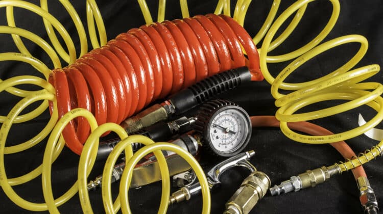 A shot of air hoses and air tools used with an air compressor