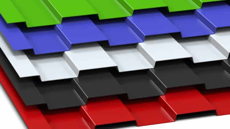 Multi-colored aluminum steel profile profiles stacked on a slate surface