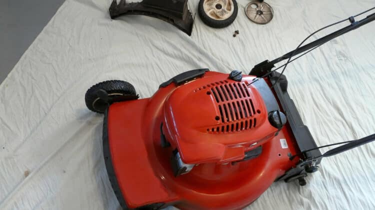 A lawnmower has been partially disassembled for servicing prior to the mowing season