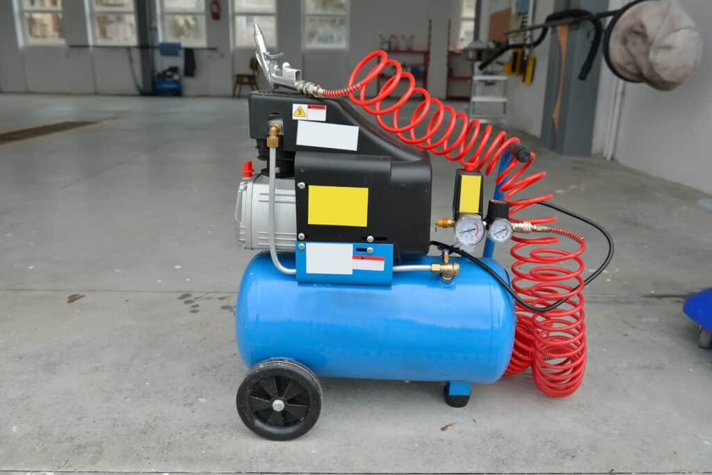 Blue pump compressor for washing cars indoor Cleaning concept