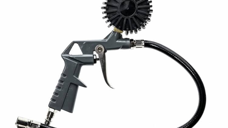 Air compressor gun with manometer isolated on a white background