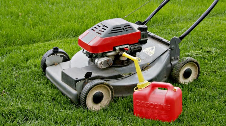 Lawn Mower and Gasoline Tank in the Field