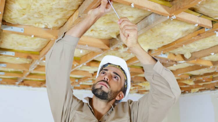 male worker on attic insulation