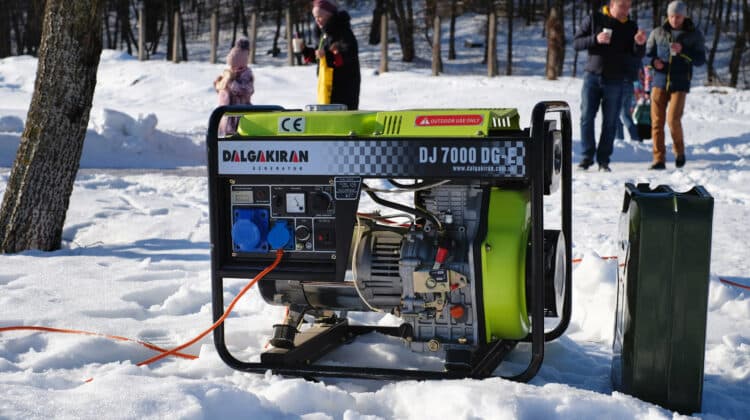 Portable electric generator running in the cold winter