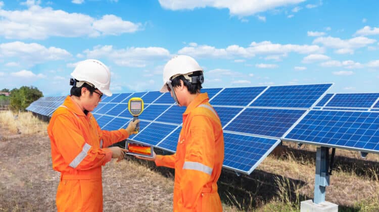 Solar panel engineer checking current temperature with infrared sensor solar energy panel and thermal heater for damage control technology technology concept with camera spectrum of plant industry