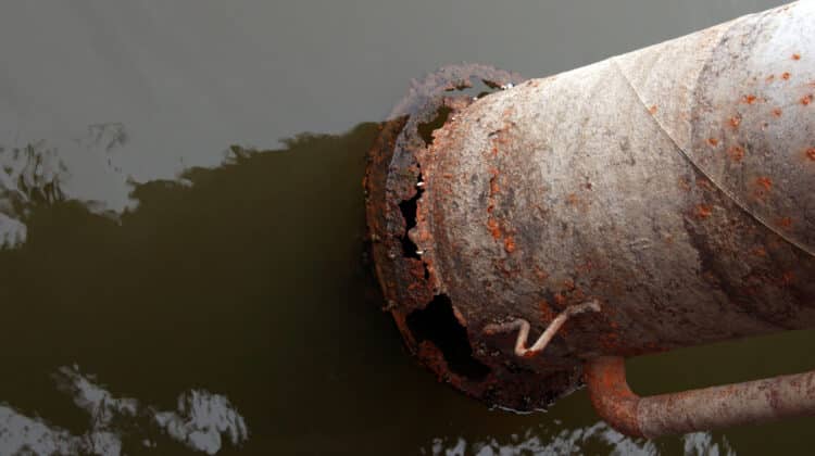 Water pipes in winter. Pipes with leaking water Rust corroded pipes for heating