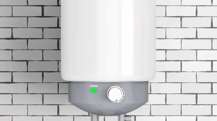 Modern heater for heating water and cold temperature on brick wall background
