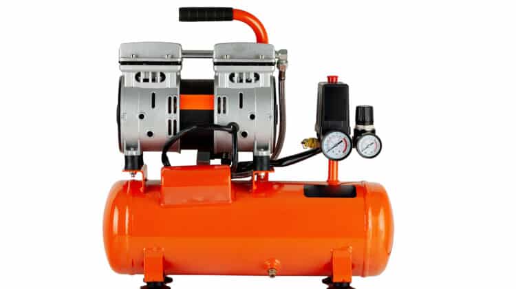 New metal air compressor with isolated white background Air compressor tool with piston and valve