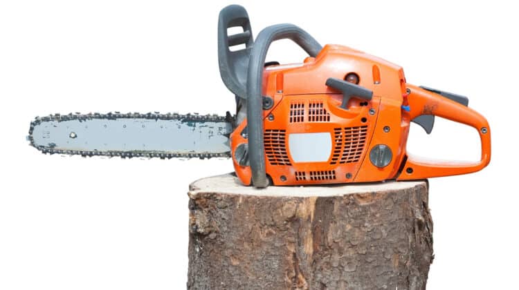 chain saw on log Isolated over white background