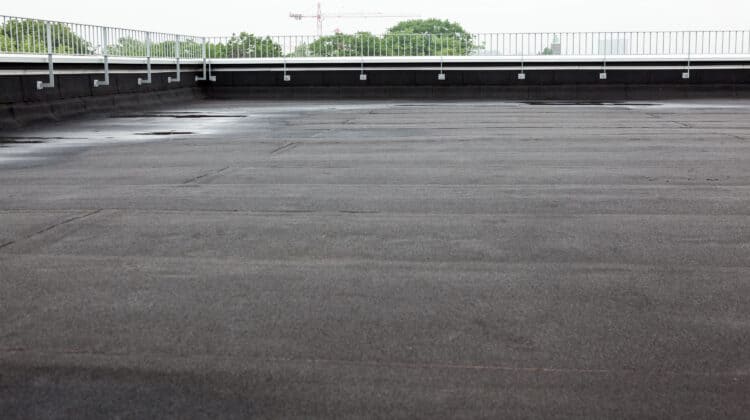Flat lay of roof installation with asphalt rolls and waterproofing Installation of insulation for the roof