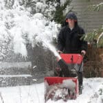 Man Using A Snow Blower